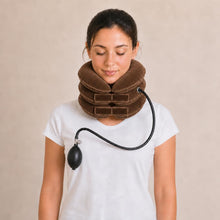 Woman wearing the coffee brown inflatable cervical traction collar, fully inflated