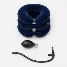 Overhead view of everything included: the inflatable collar, the hand pump with metal locking valve and the flexible tube